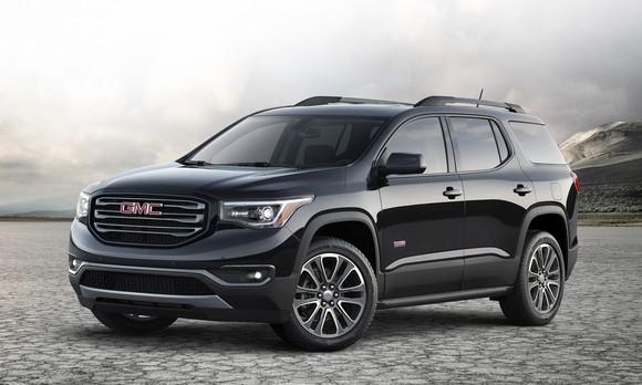 A black 2017 GMC Acadia crossover SUV. 