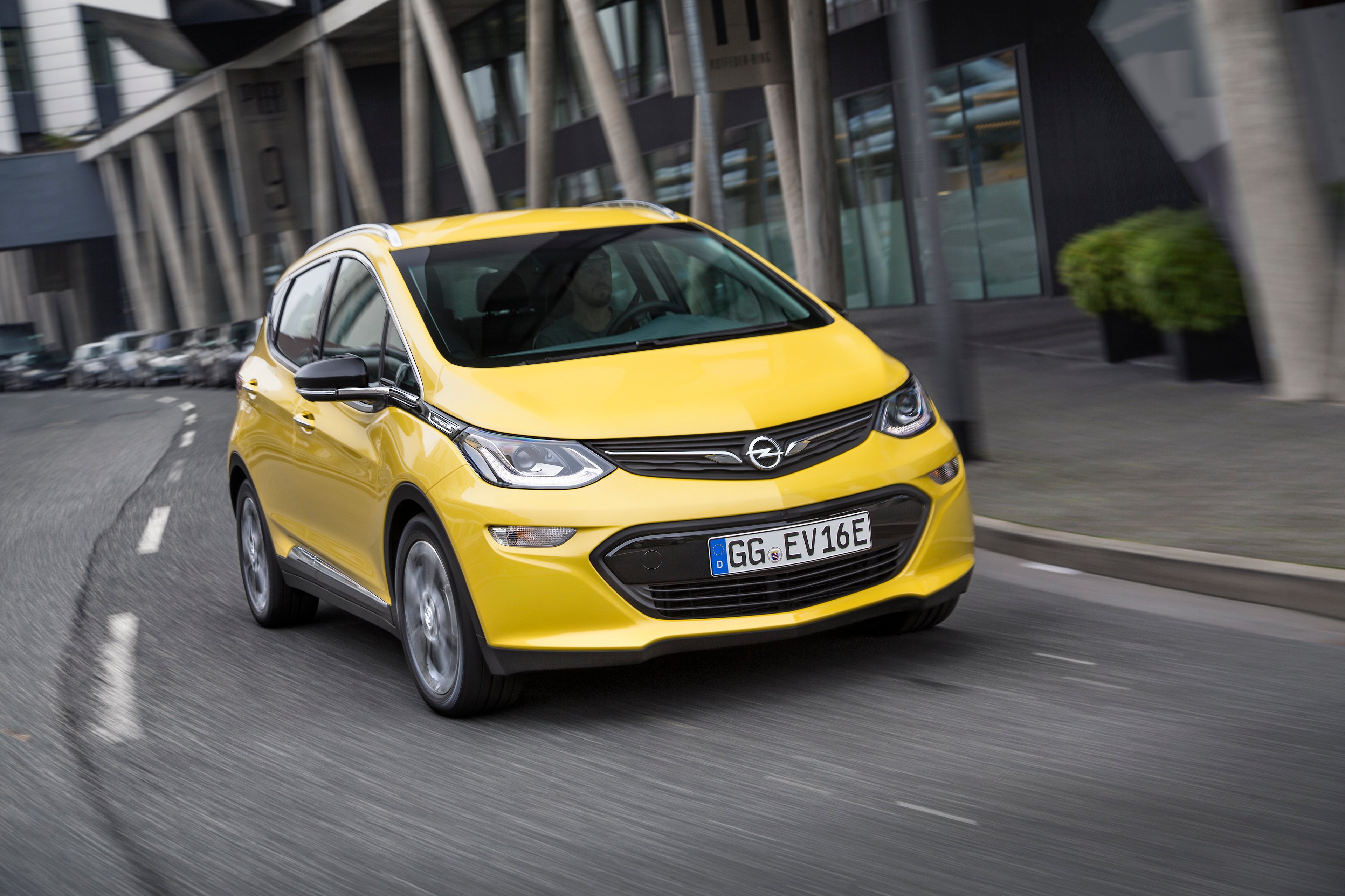 A yellow Opel Ampera-e crossover. 