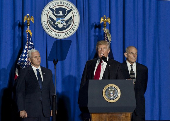 Donald Trump flanked by VP Mike Pence and DHS Secretary John Kelly.