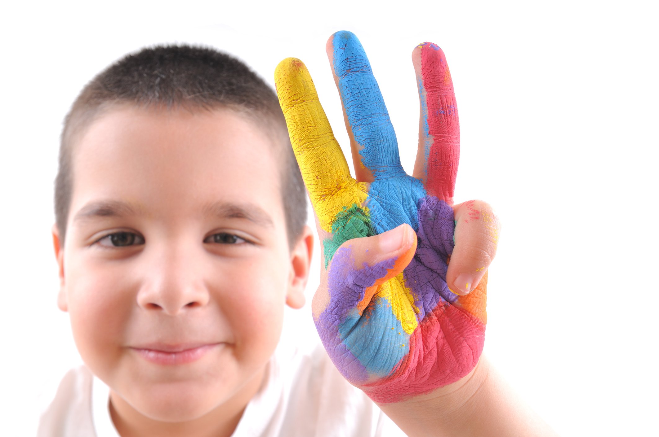 Kid holding up three fingers.