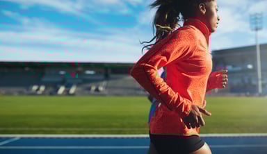 Athlete Sports Woman Running on a Track