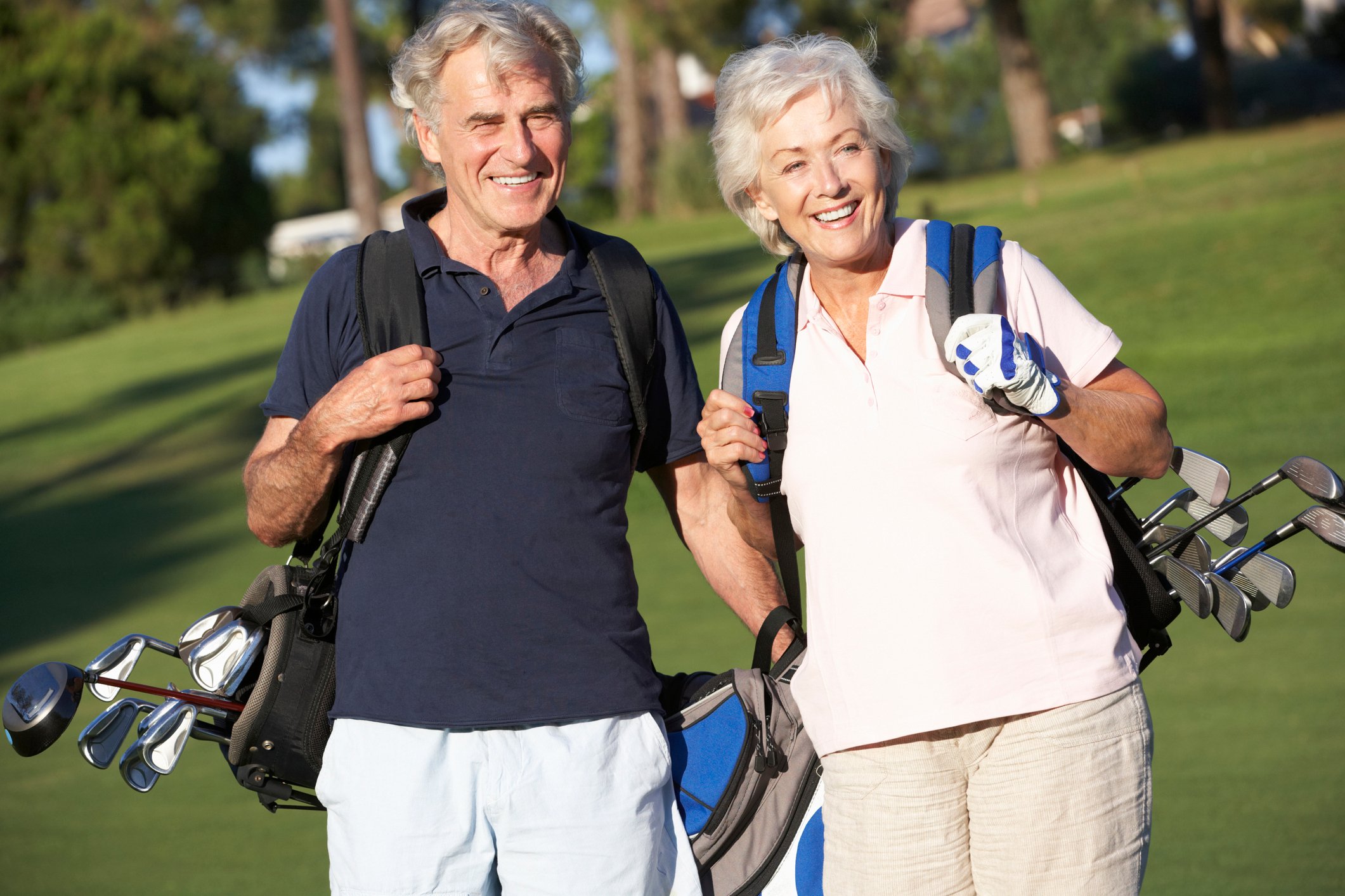 Senior couple playing golf