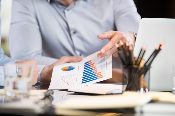 Business people analyzing a graph.