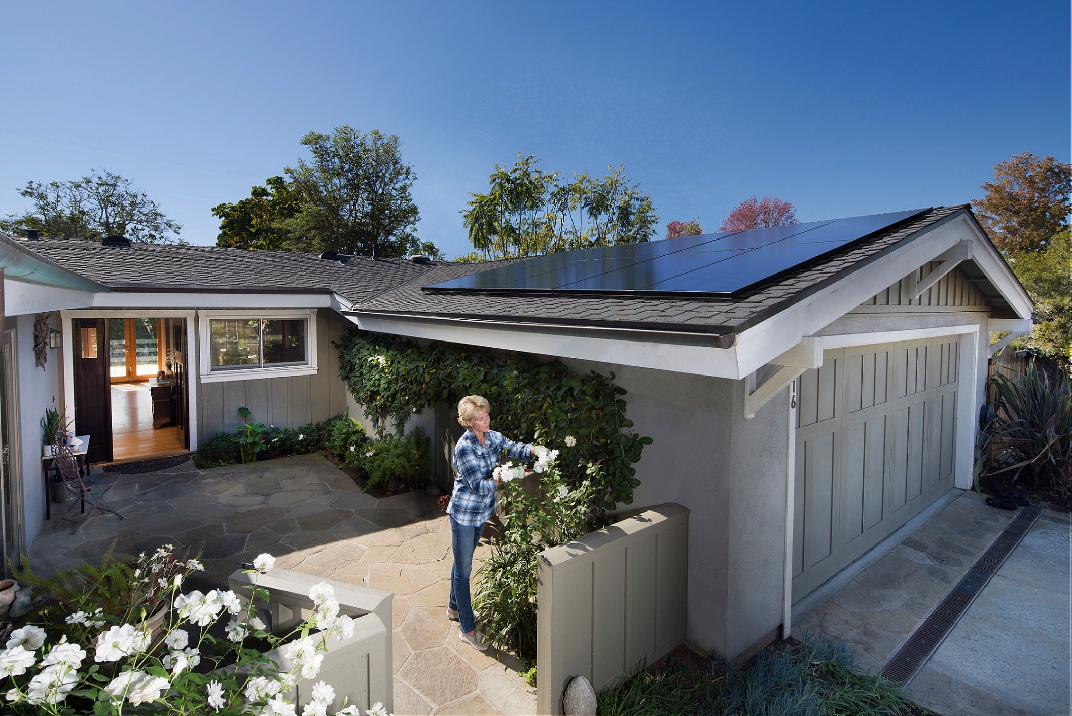 Image of a single family home with rooftop solar panels.