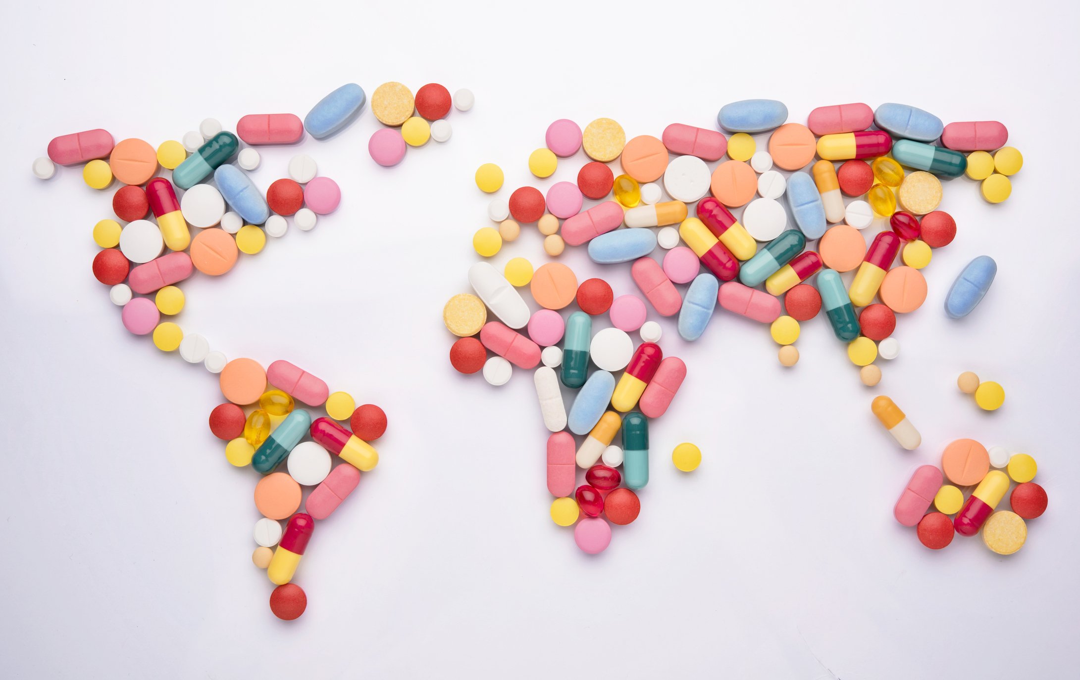 Pills arranged in the shape of the continents.