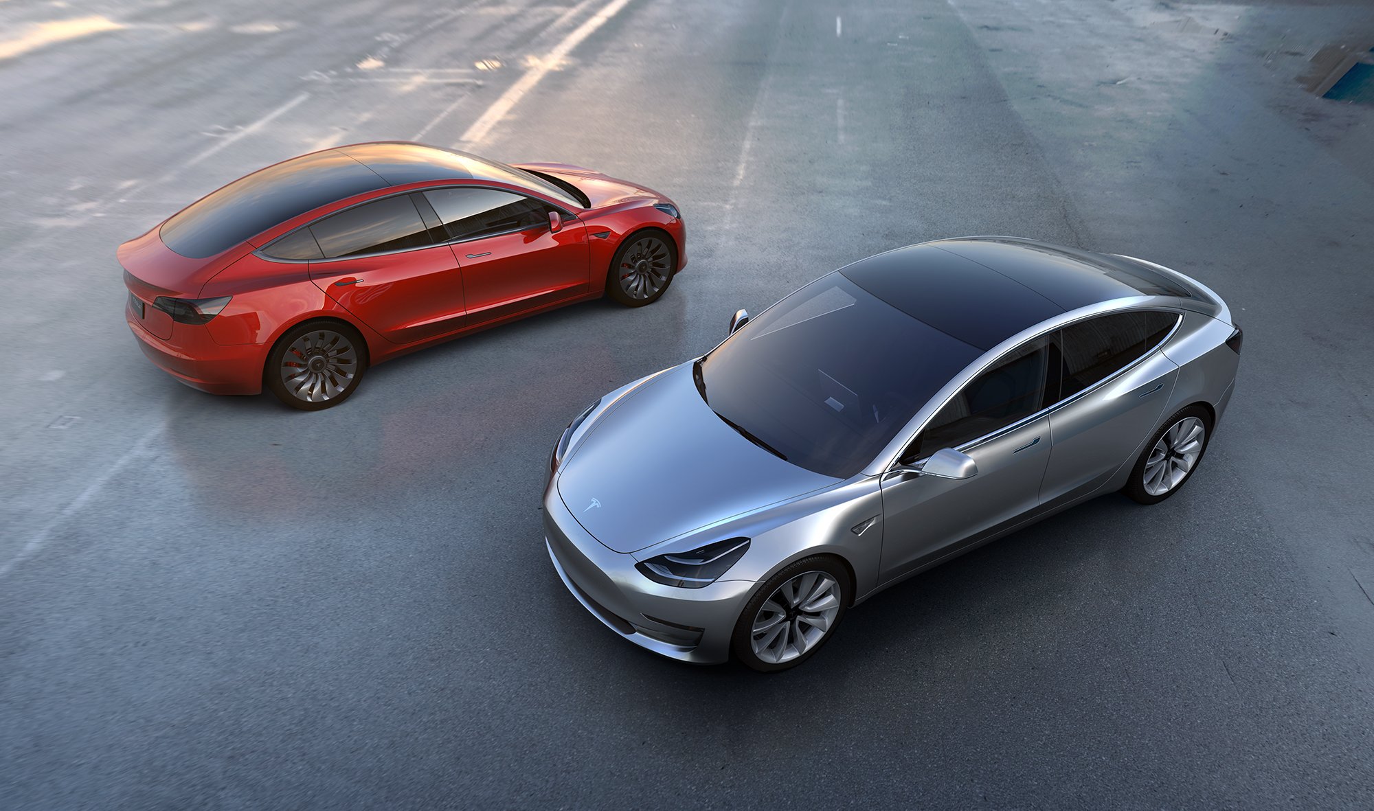 Picture of two Model 3 sedans.