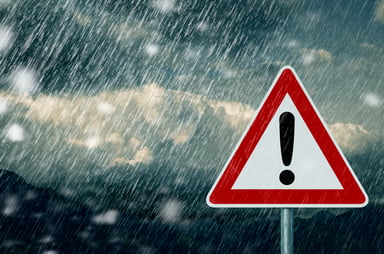 Caution sign in stormy weather