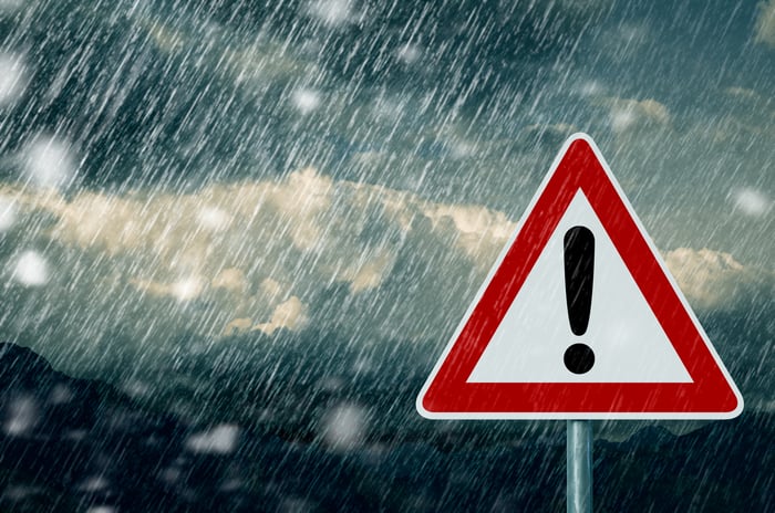 Caution sign in stormy weather