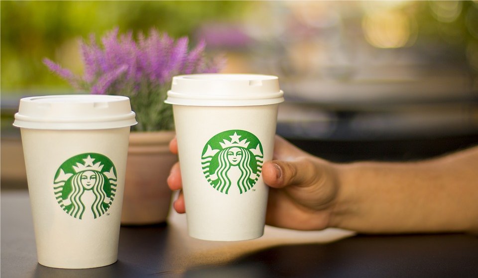 Two Starbucks paper cups