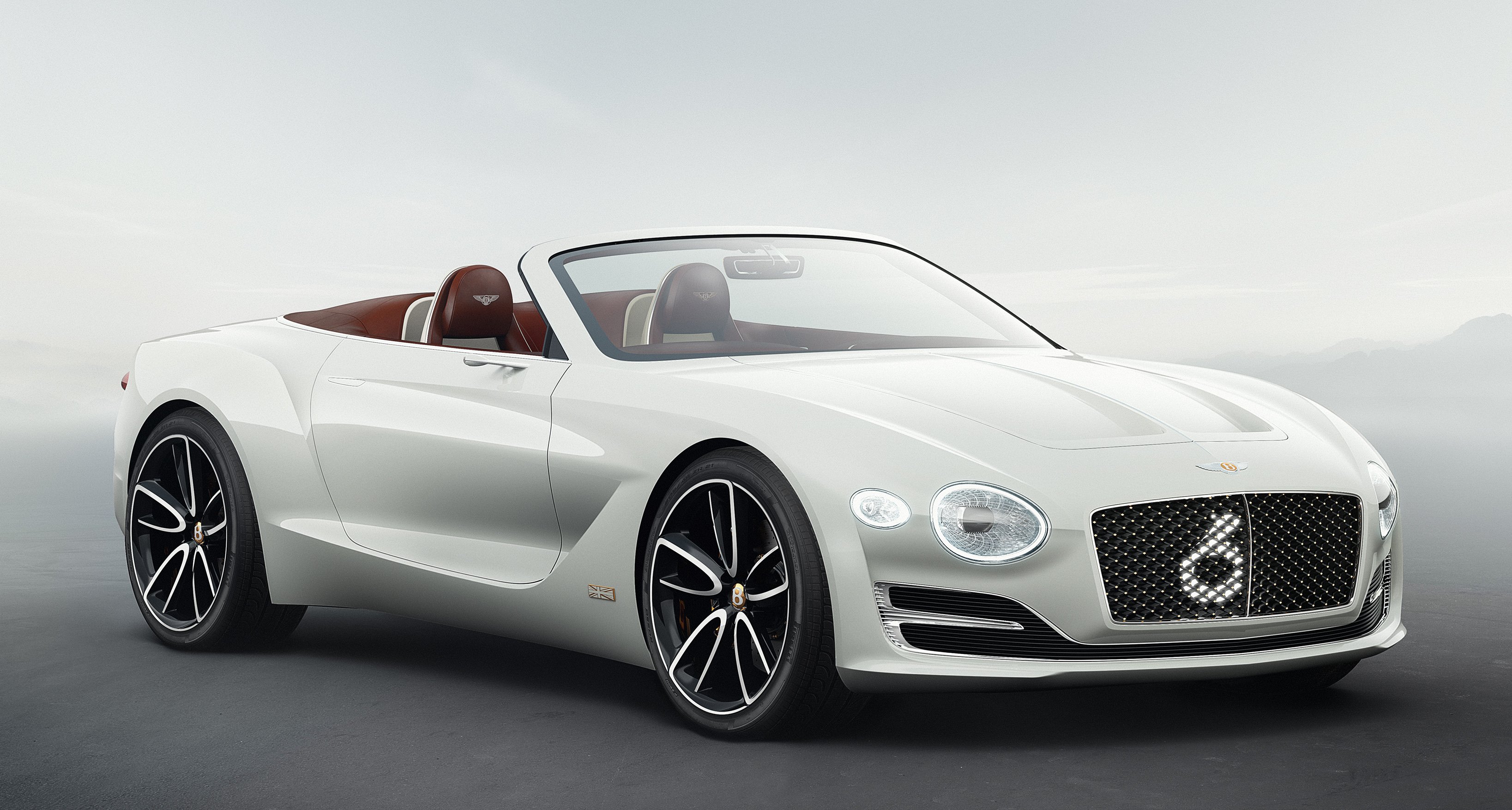 A white two-door Bentley convertible. 