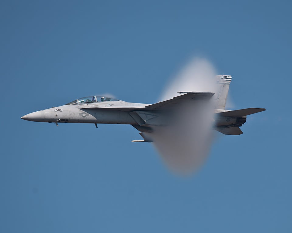 Boeing F/A-18 fighter breaking the sound barrier.