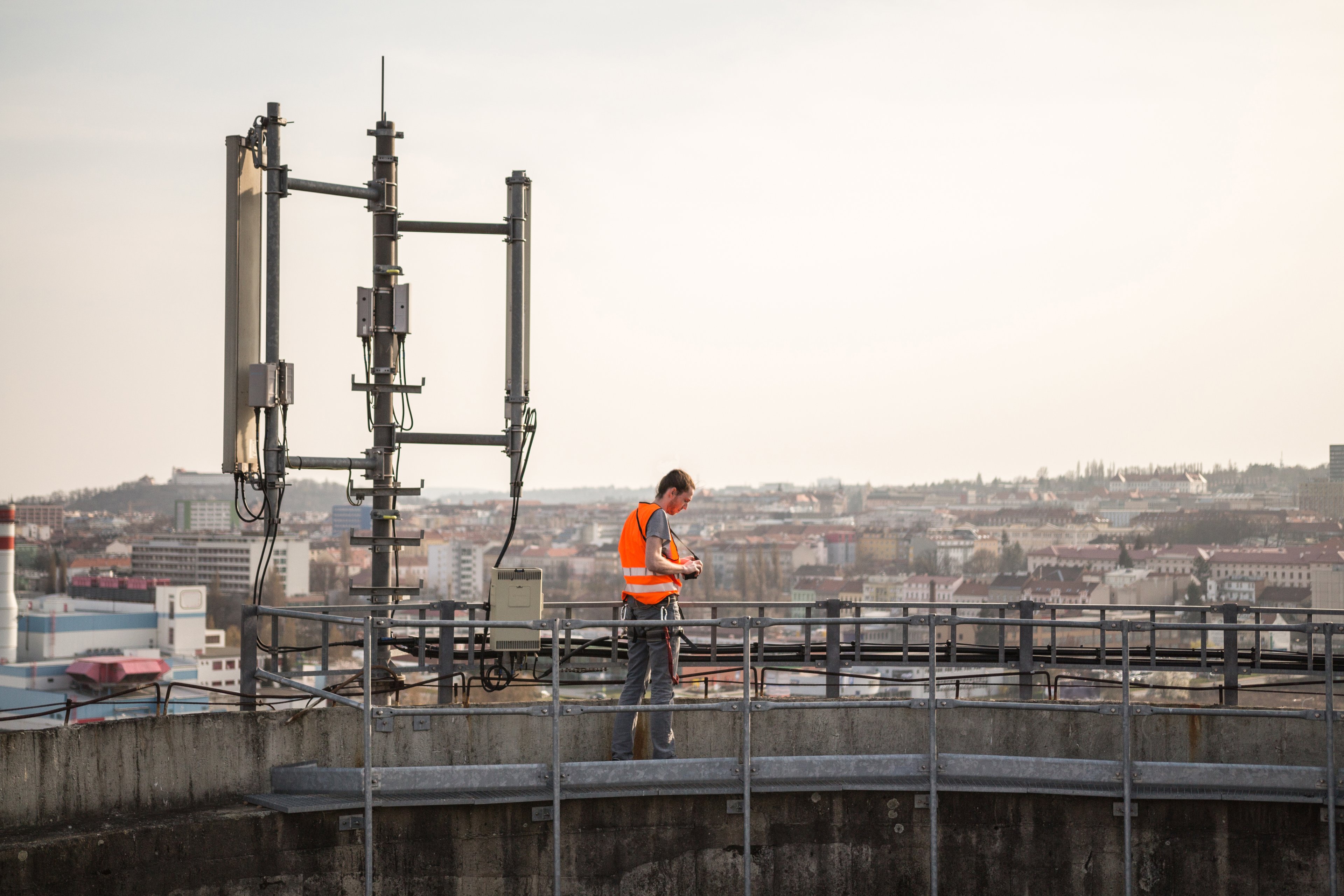 A telecom worker examining a base station