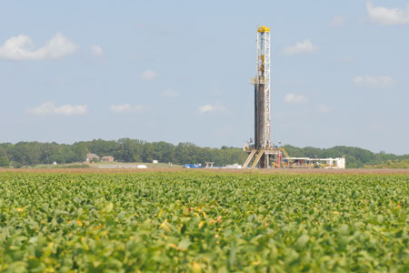A drilling rig in a field. 