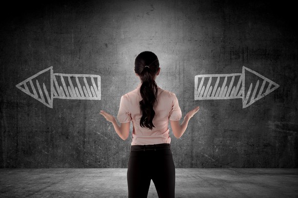 Woman making decision with arrows facing left and right