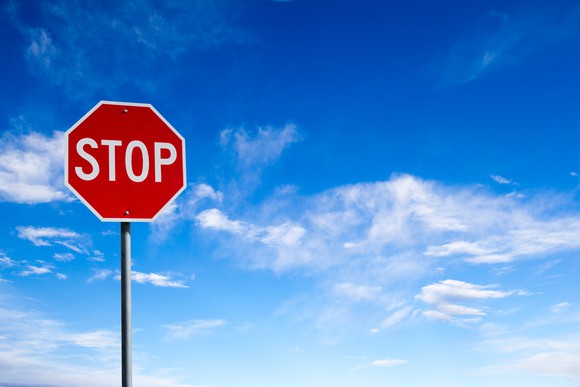 Picture of stop sign with sky in the background.