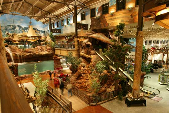 There's a theme park or museum-like quality to the interior of a Bass Pro Shops store