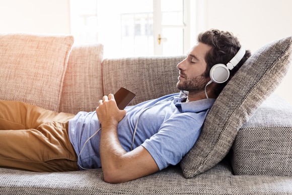 Man listening to music on his smartphone