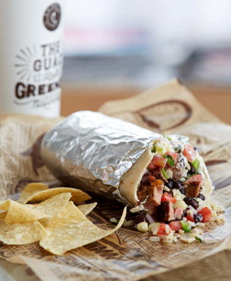 Chipotle burrito showing the yummy insides with chips.
