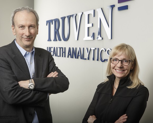 Truven Health Analytics CEO Mike Boswood, left, and IBM Watson Health General Manager Deborah DiSanzo, right.