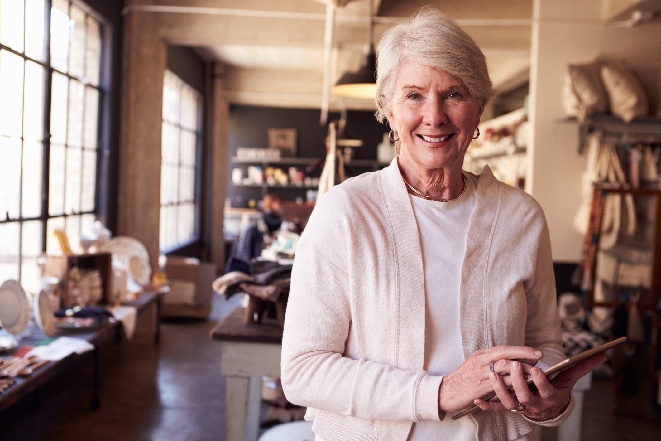Senior woman working in a store.