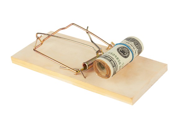 Roll of cash on a mouse trap.