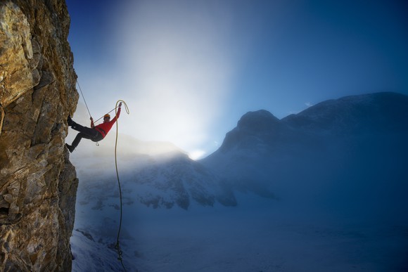Man climbing a mountain