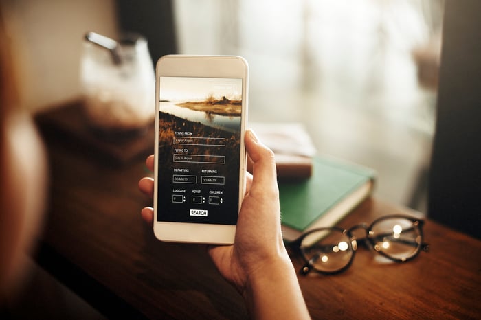 A hand holds a smartphone
