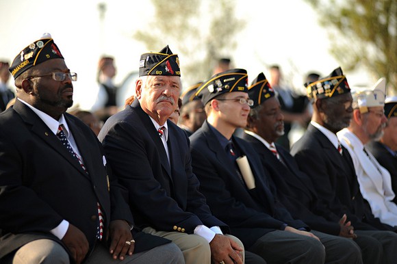 Veterans sitting in attendance for a 9/11 remembrance parade. 