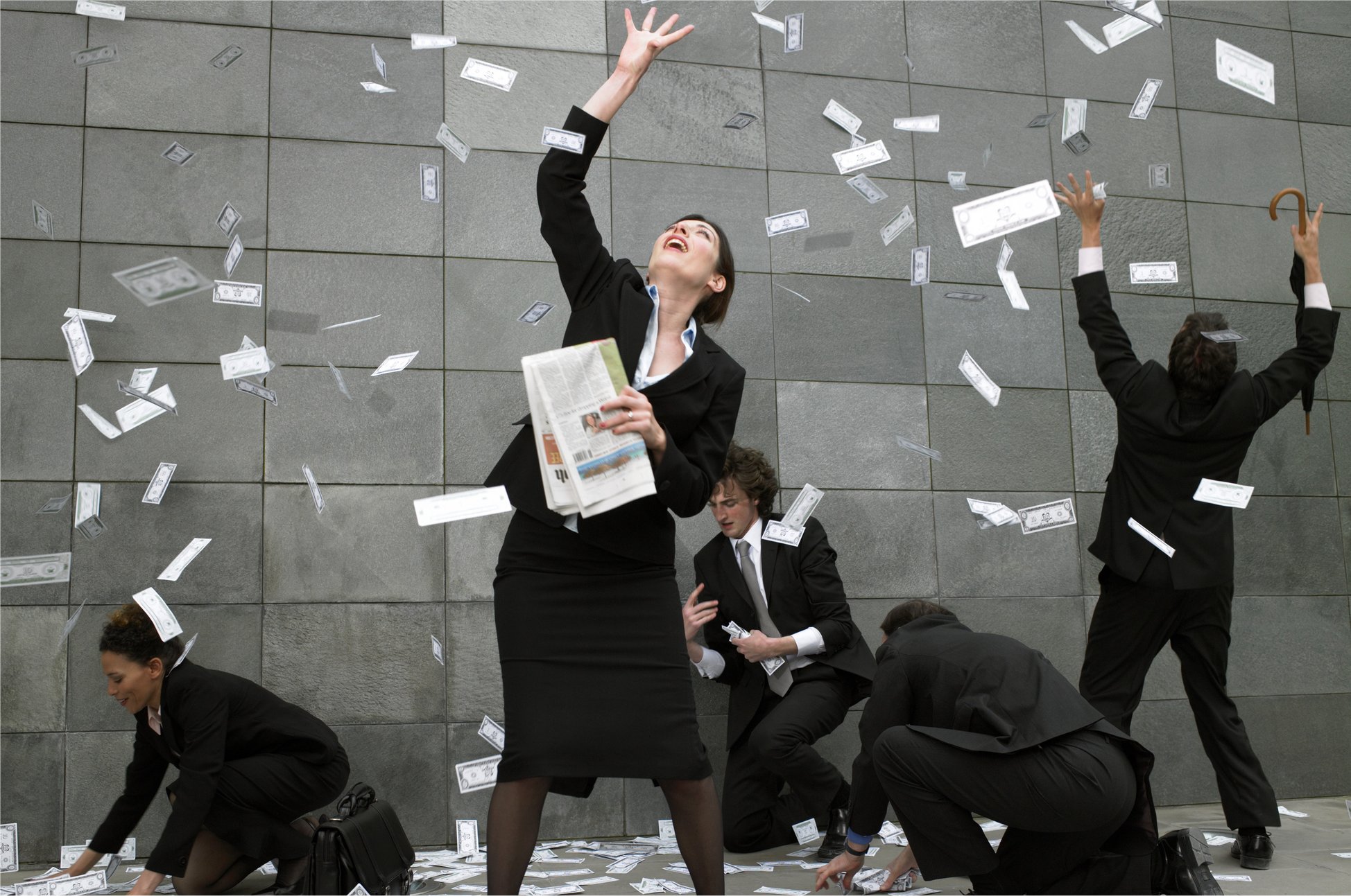 Raining money onto happy people.