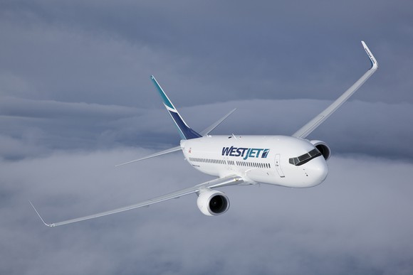 A WestJet plane in flight. 