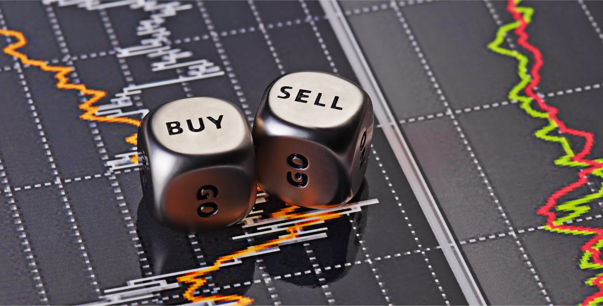 "Buy" and "Sell" dice on top of a stock chart.