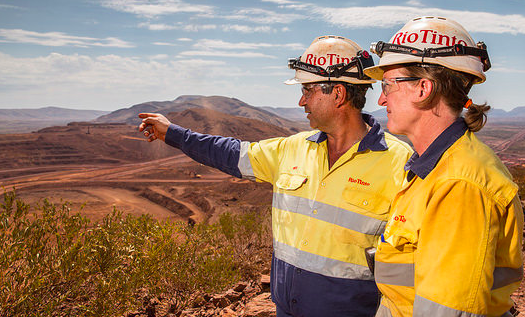 Rio Tinto employees looking out over the land.