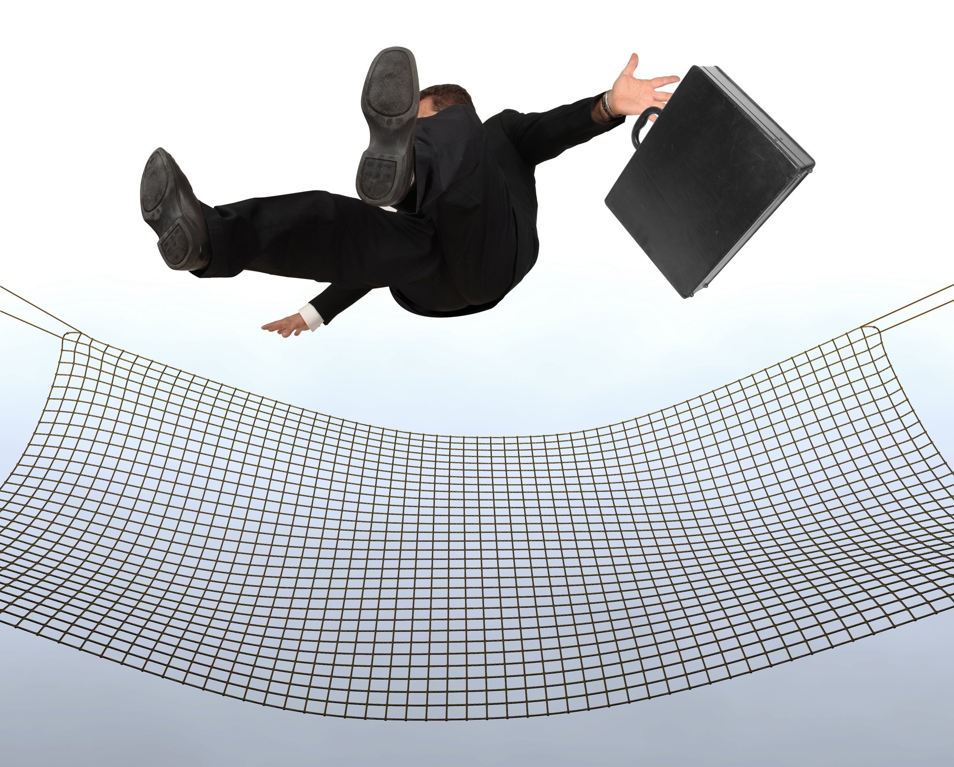 A business person falls from the sky into a net.