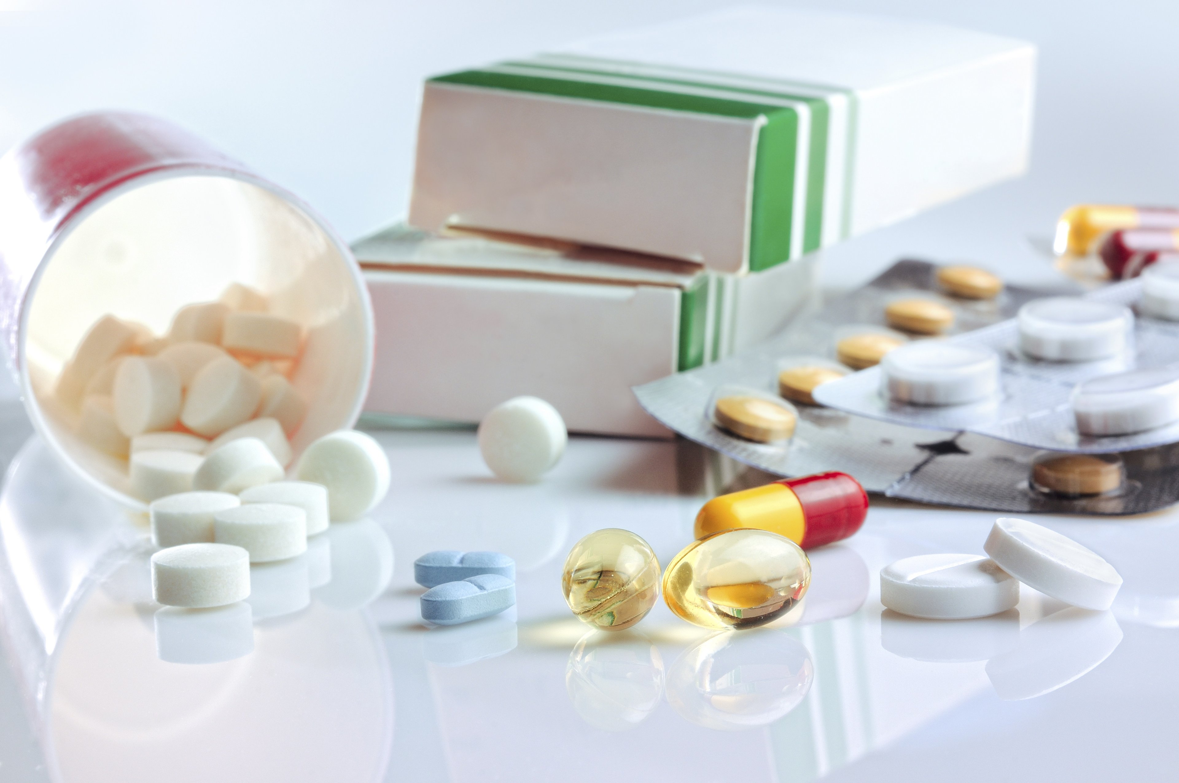 Prescription drugs on top of glass table.