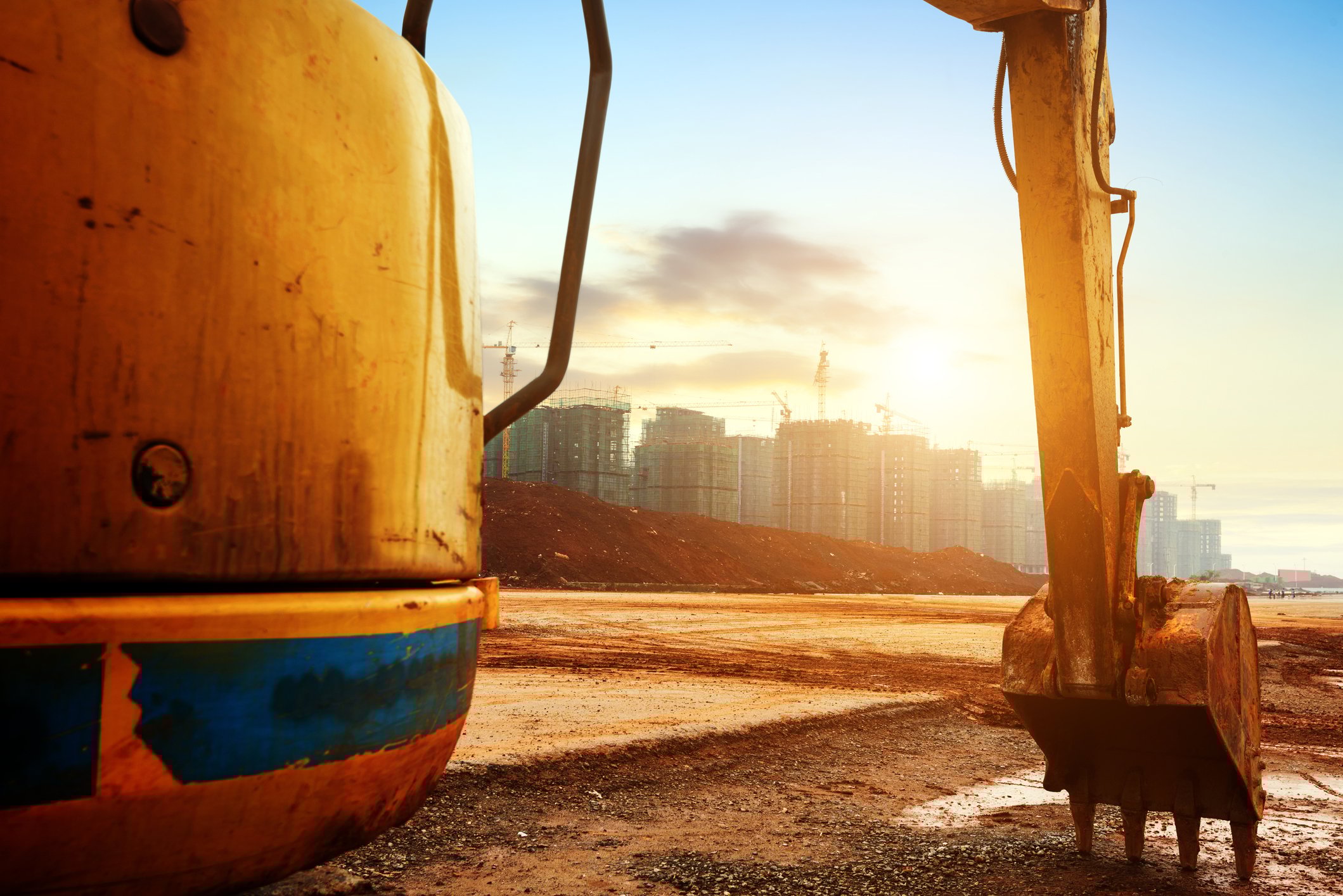 Construction equipment during sunrise