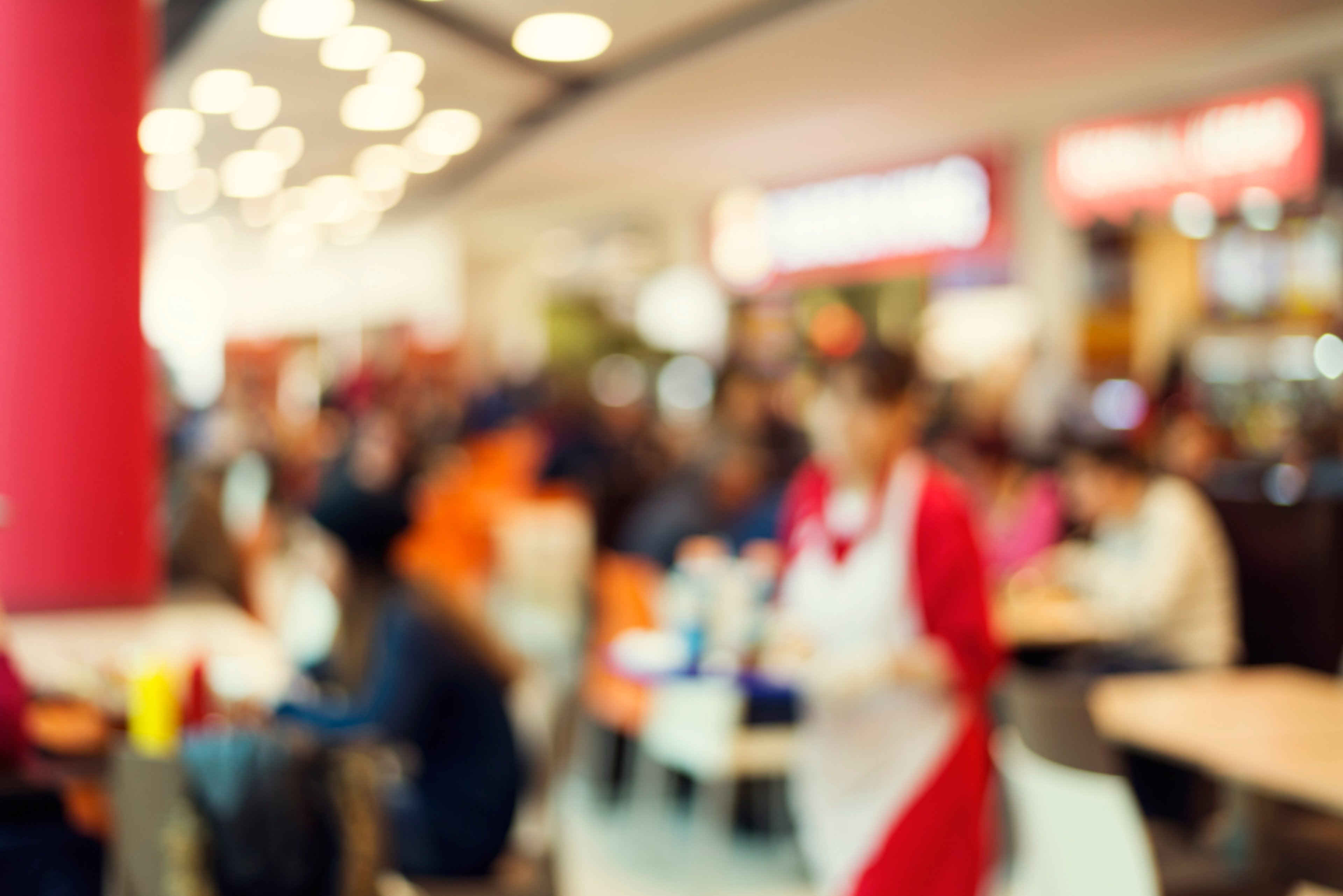A blurred image of the inside of a restaurant.
