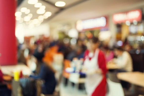 A blurred image of the inside of a restaurant.
