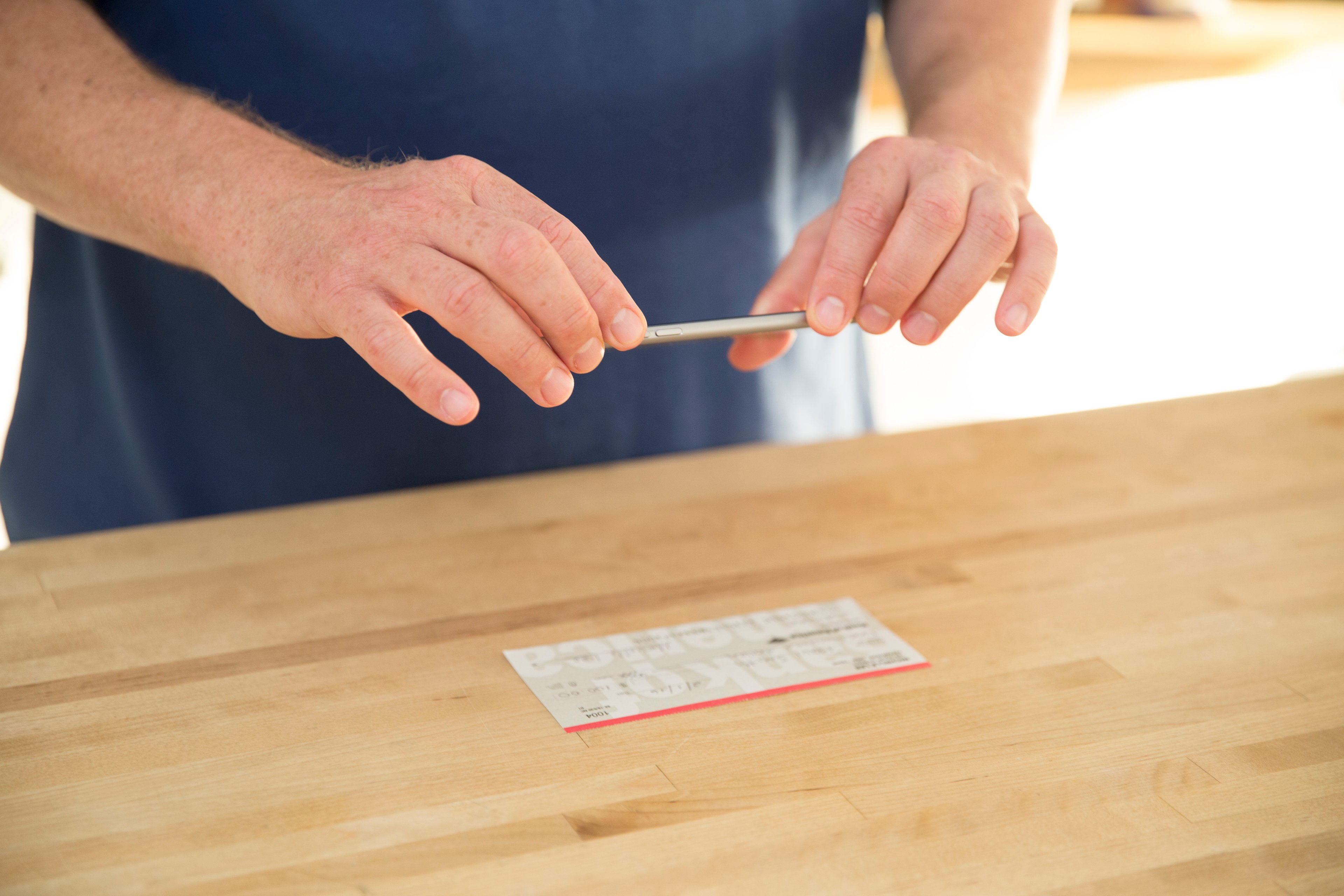 A mobile banking consumer taking a picture of his check. 