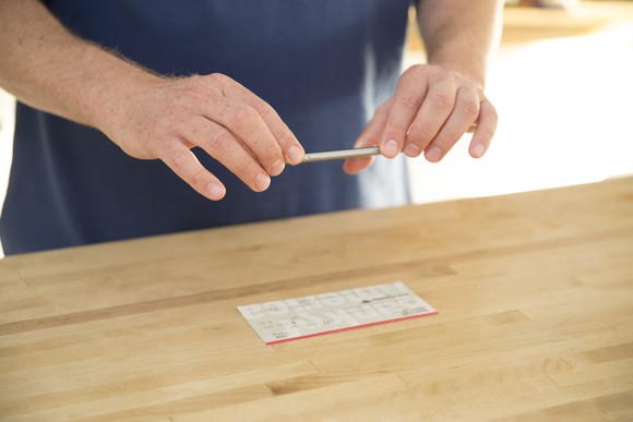 A mobile banking consumer taking a picture of his check. 