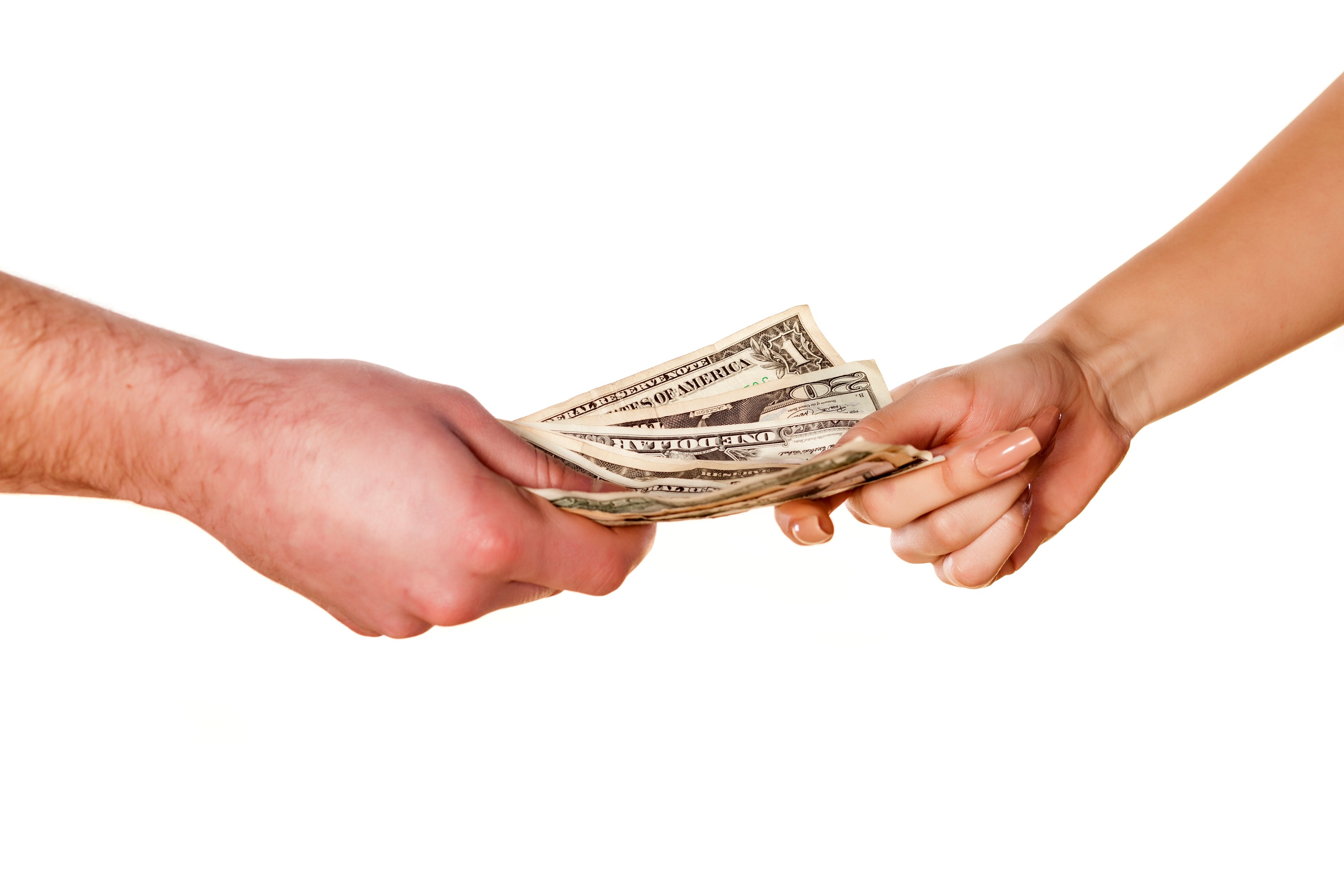 A hand hands another hand cash