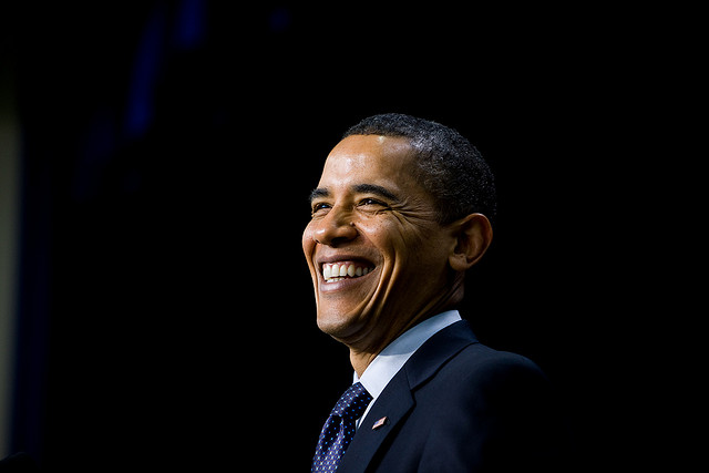 Former President Barack Obama smiling.