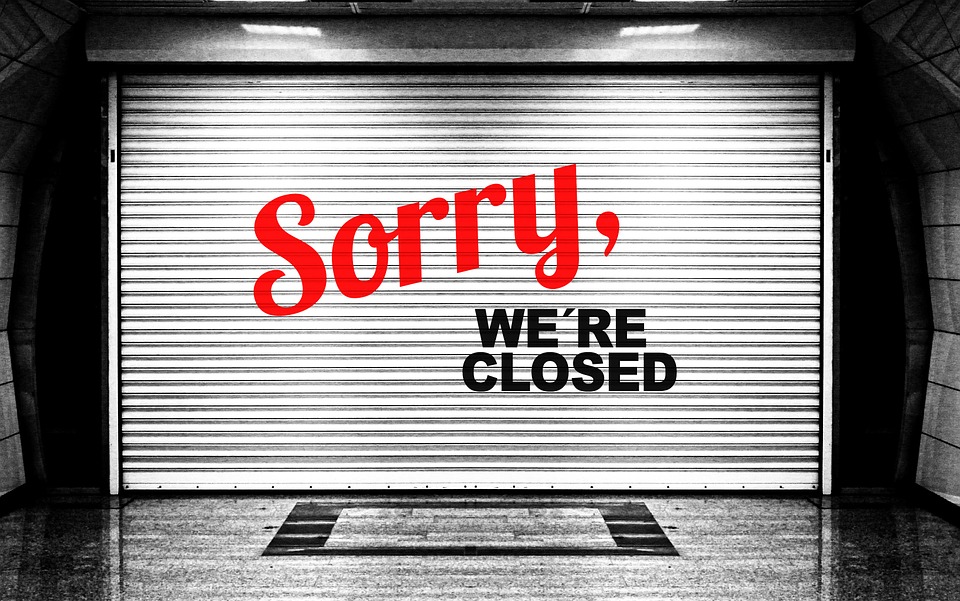 A "sorry we're closed" sign, representing insurers who are fleeing Obamacare exchanges. 