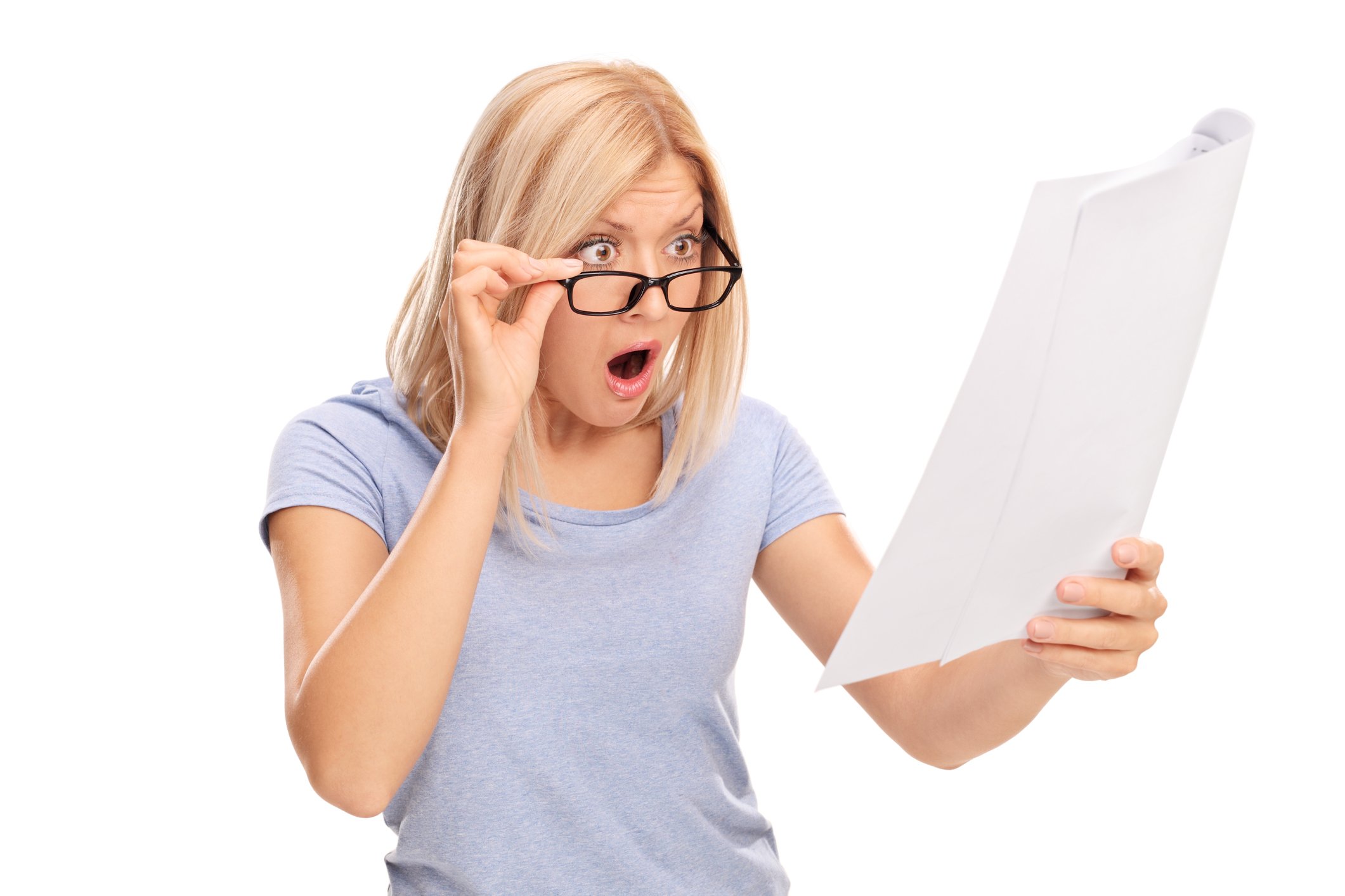 Woman looking at her tax return in shock