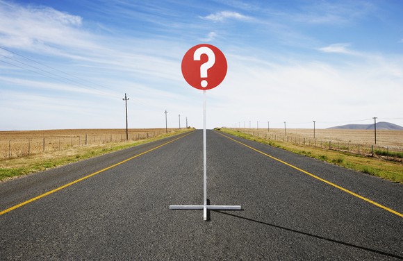 Question sign in the middle of a road