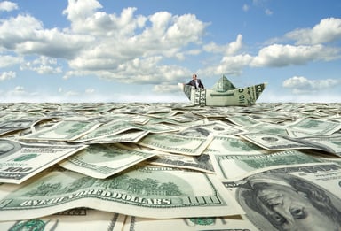 Boat on sea of cash