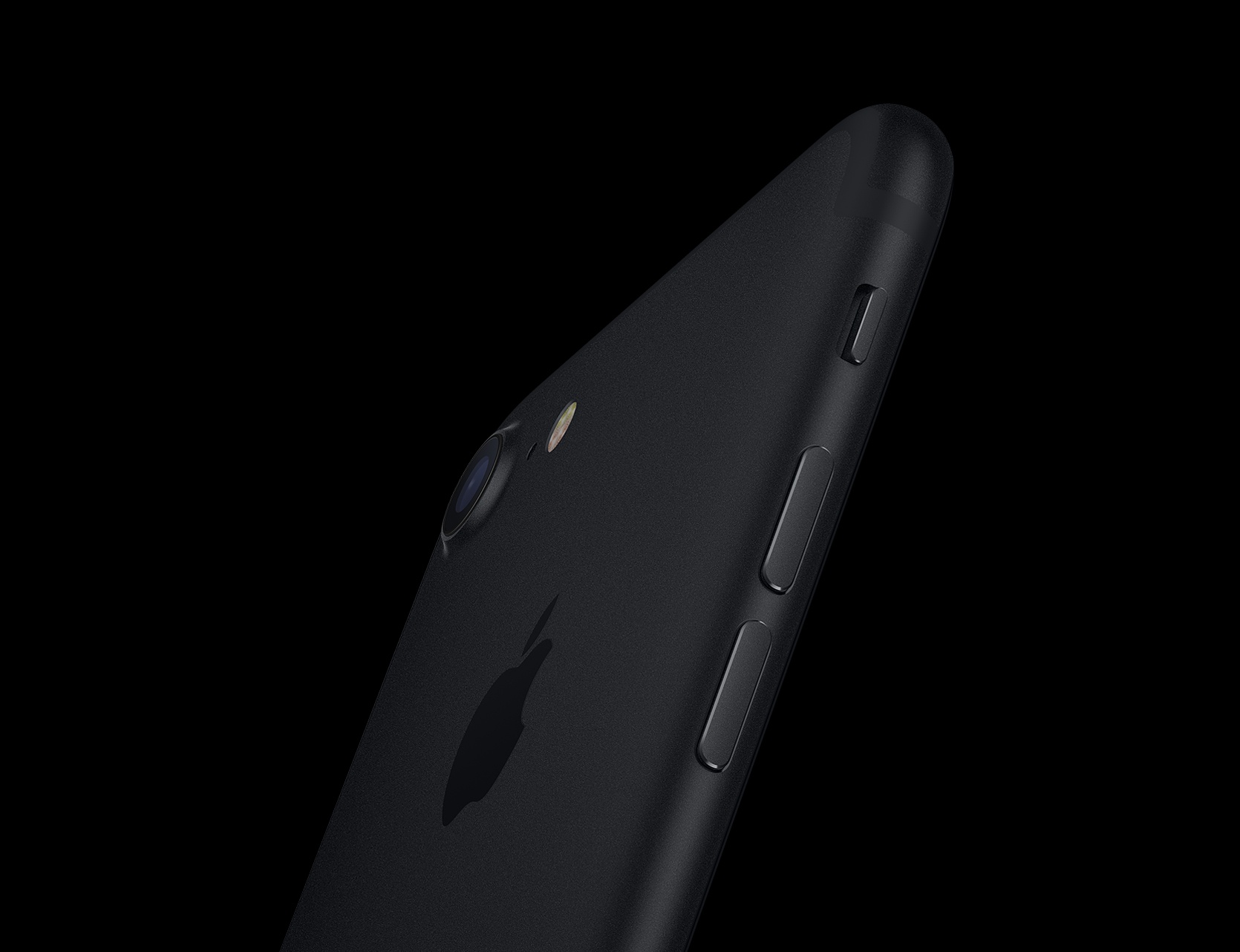 The iPhone 7 in black against a black background.