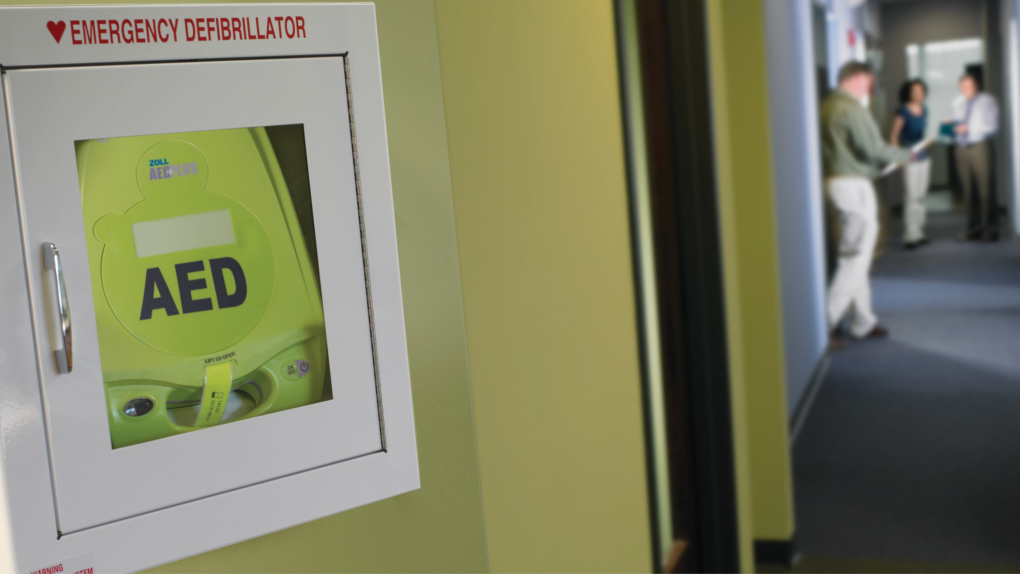 AED device installed in a wall.