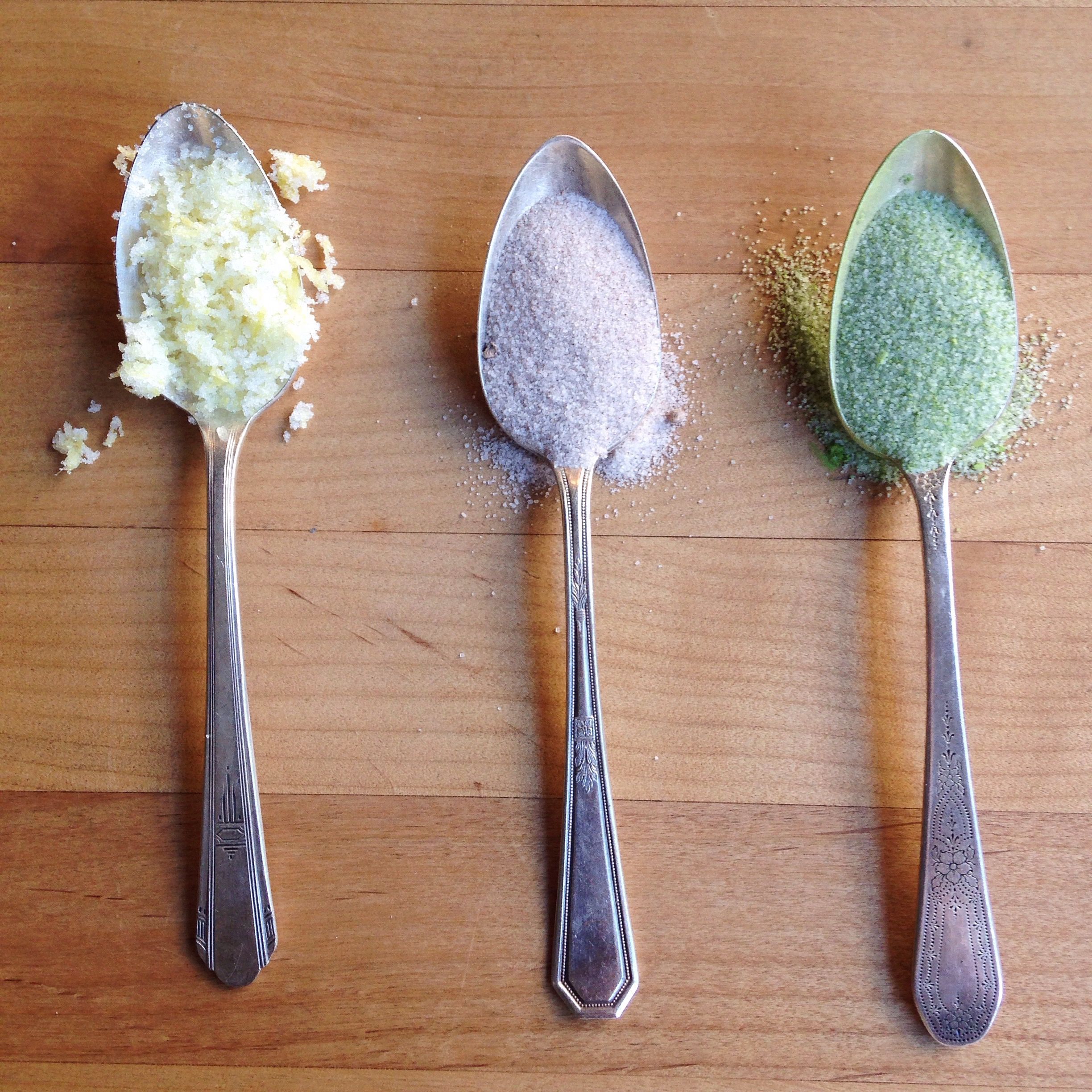 Three spoons with different spices.