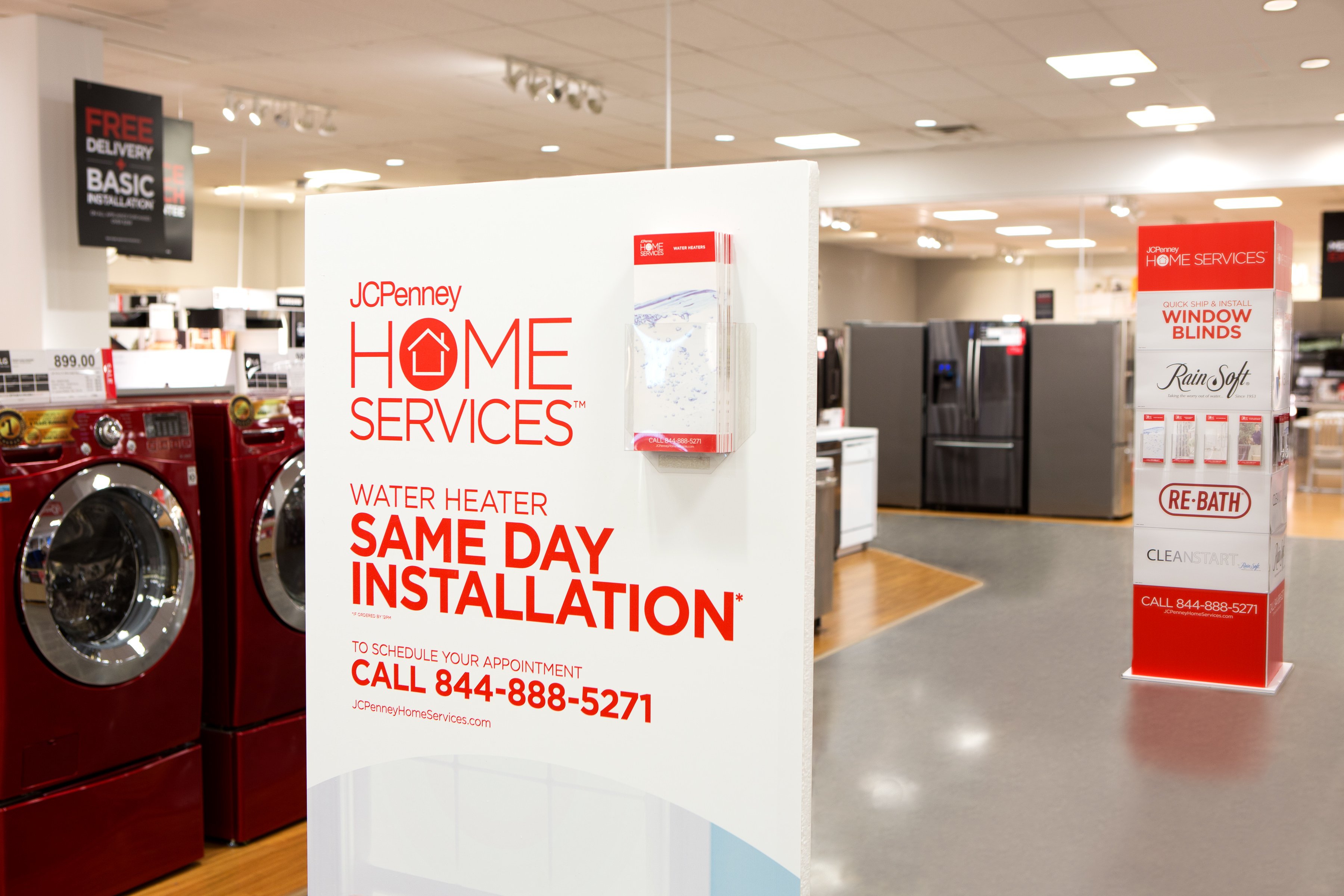 A display advertising J.C. Penney's home services in a store.