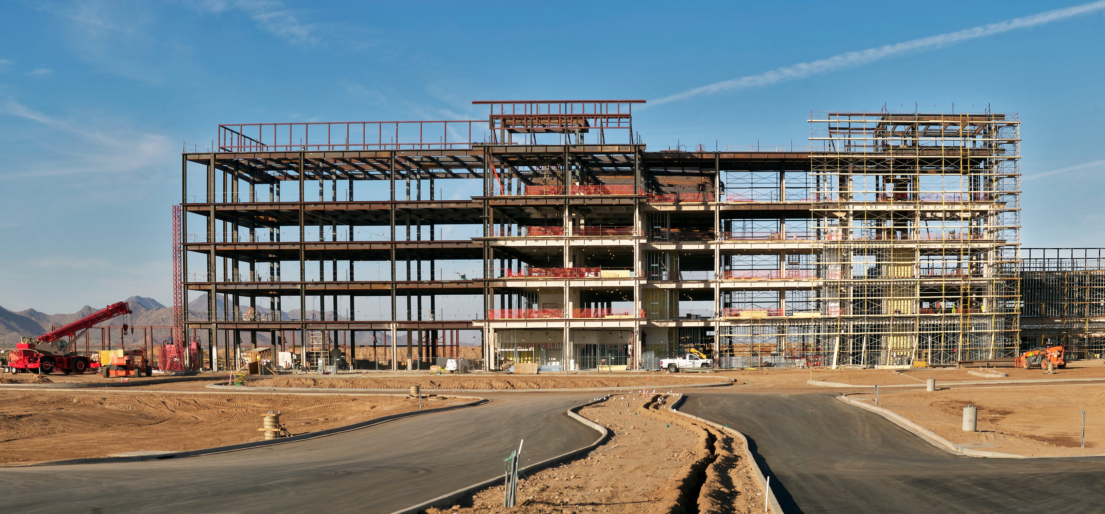 A commercial construction site showing the skeleton of a building